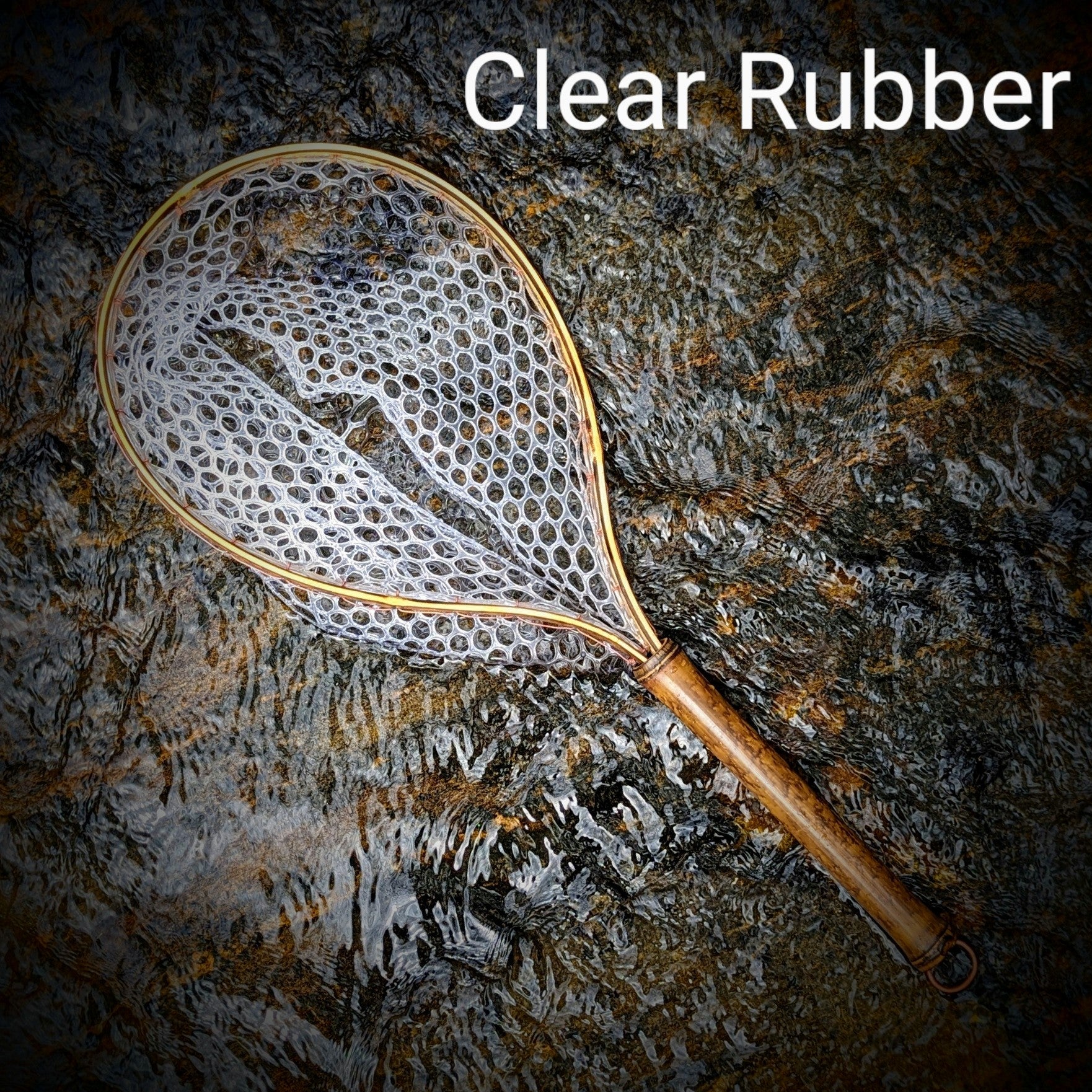 A bamboo fly fishing net lying on a rock in the water on the river in Western North Carolina. The rubber net basket is smooth and shiny and protects the fish for catch and release. The handle is flame cured for strength and durability and there is copper stitching and a copper keeper ring to attach your net keeper to.